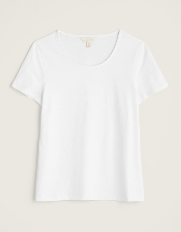 woman wearing organic white cotton t shirt short sleeves and a scoop neckline