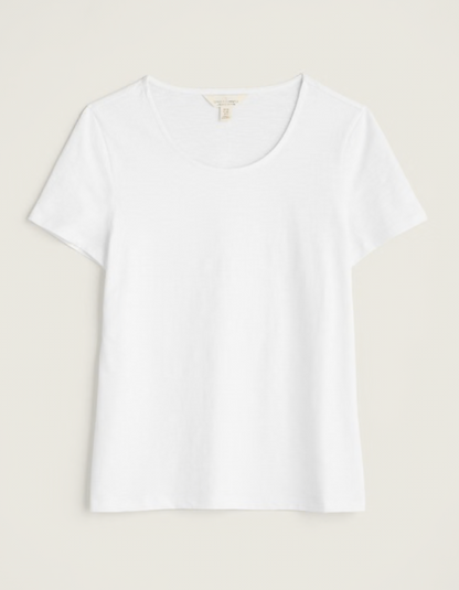 woman wearing organic white cotton t shirt short sleeves and a scoop neckline