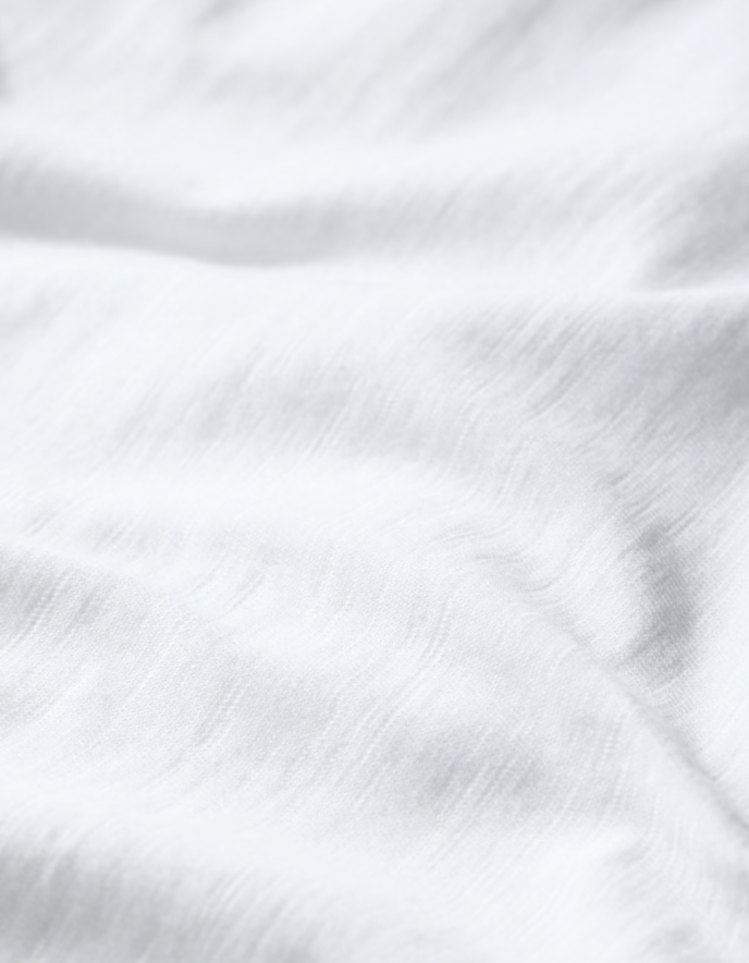 woman wearing organic white cotton t shirt short sleeves and a scoop neckline