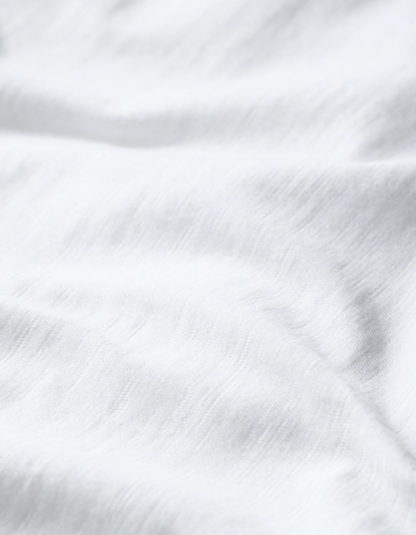 woman wearing organic white cotton t shirt short sleeves and a scoop neckline
