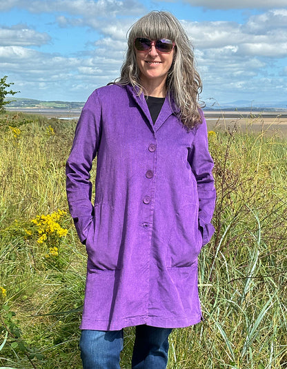 purple velvet coat with collar, button front and two patch pockets. willy Wonka vibes