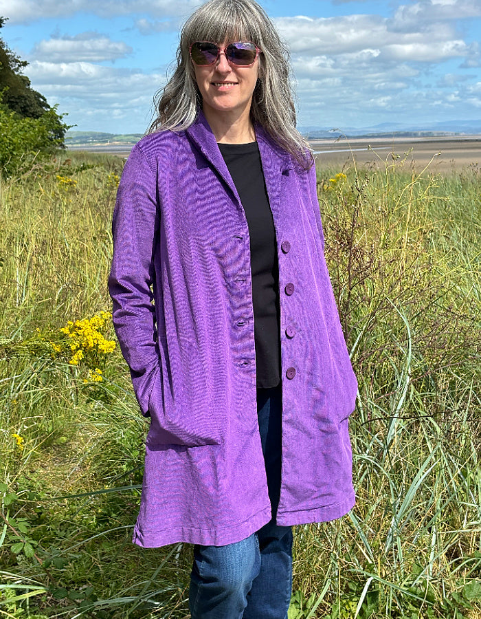 purple velvet coat with collar, button front and two patch pockets. willy Wonka vibes