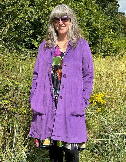 purple velvet coat with collar, button front and two patch pockets. willy Wonka vibes