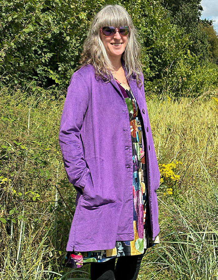 purple velvet coat with collar, button front and two patch pockets. willy Wonka vibes