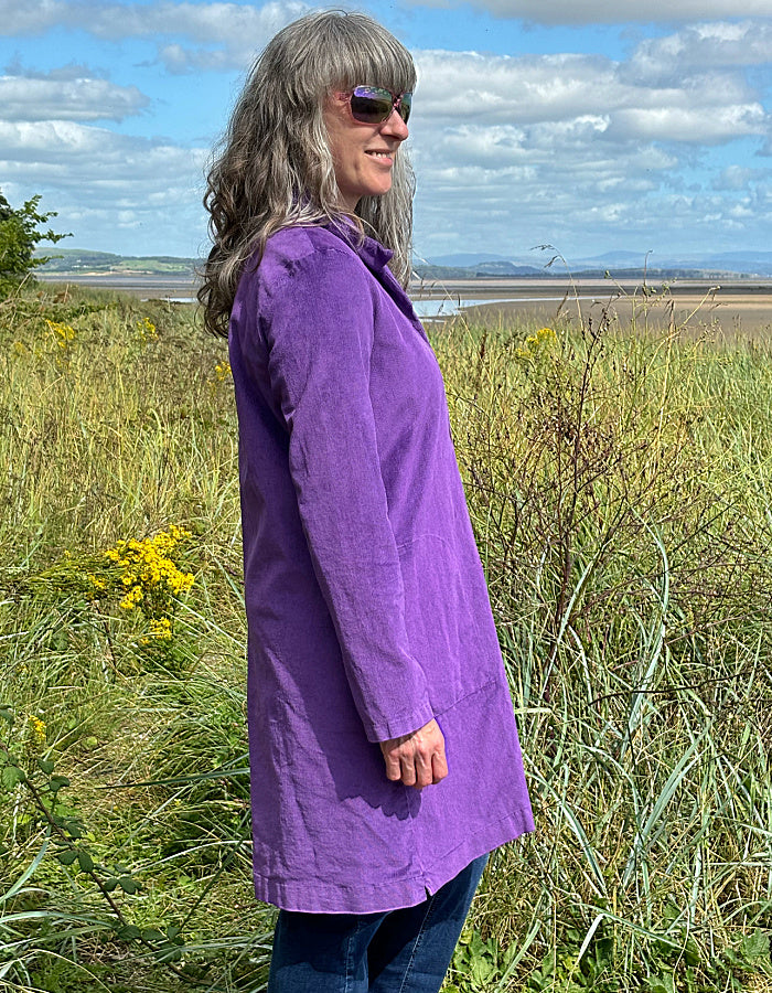 purple velvet coat with collar, button front and two patch pockets. willy Wonka vibes