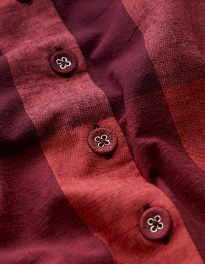Close-up of a red fabric with buttons