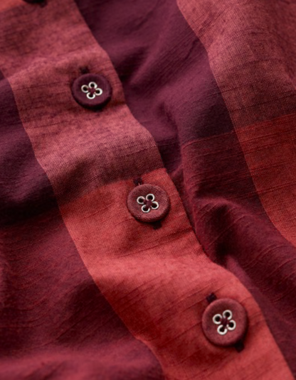 Close-up of a red fabric with buttons