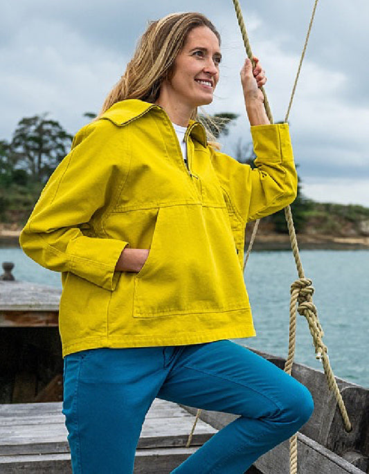 woman wearing a yellow cotton canvas fisherman smock jacket