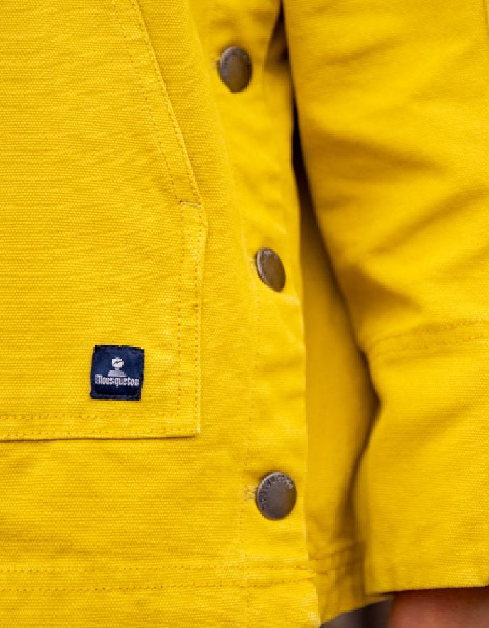 woman wearing a yellow cotton canvas fisherman smock jacket
