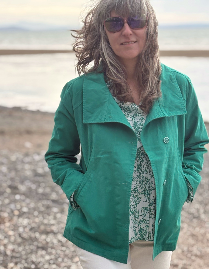 woman wearing jade green cotton summer jacket