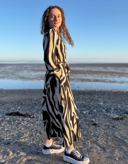 woman wearing zebra print shirt dress