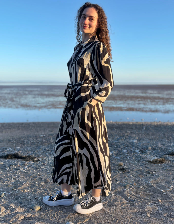 woman wearing zebra print shirt dress