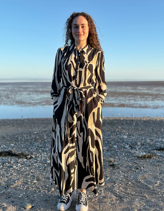 woman wearing zebra print shirt dress