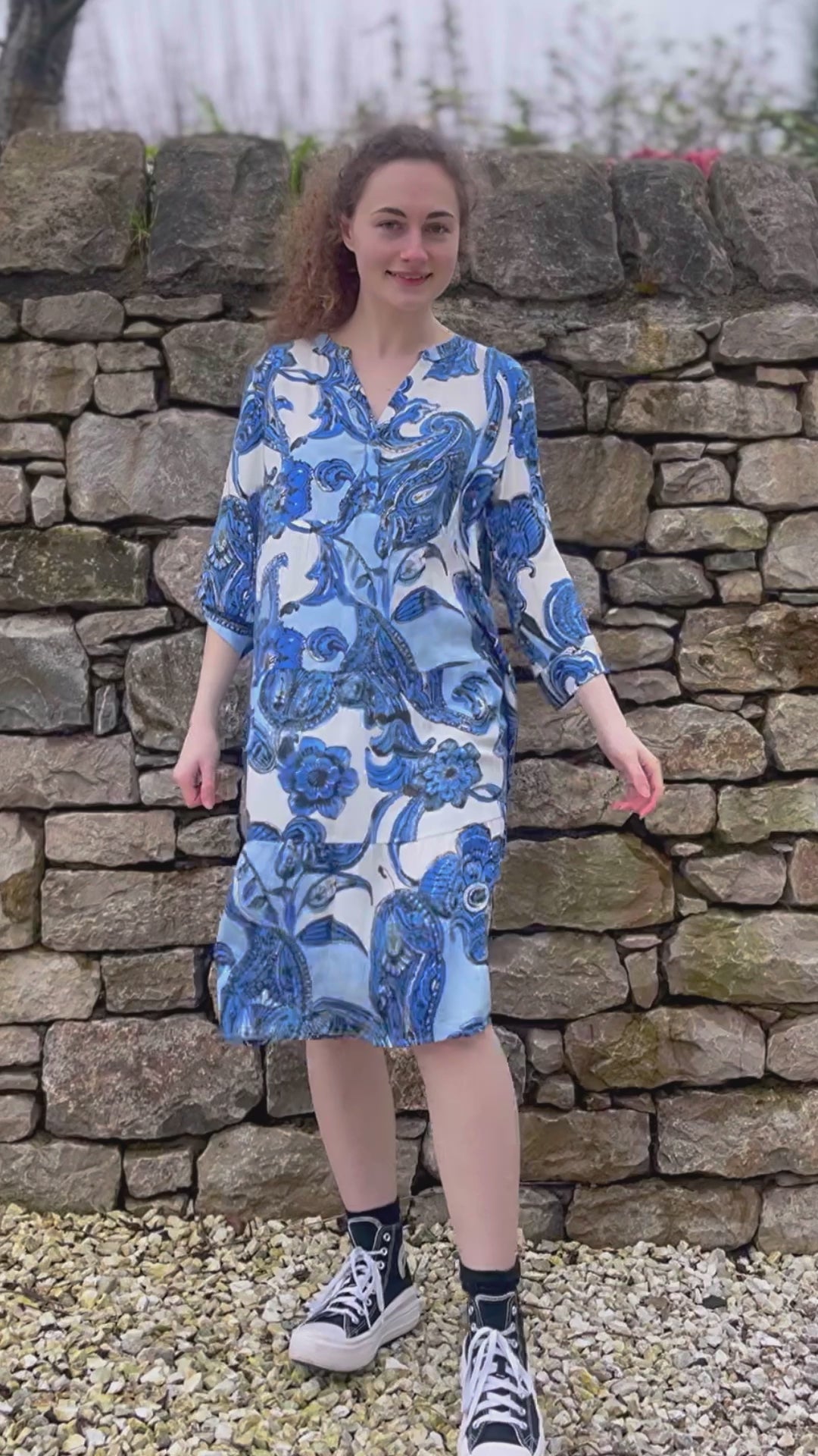 blue and white paisley print tiered knee length dress with sleeves