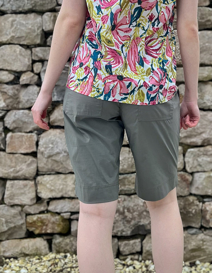 khaki cargo shorts, mid thigh length with pockets and button fly closure