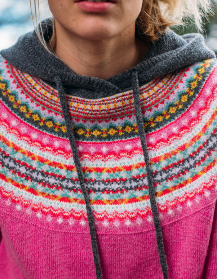 eribe alpine hooded sweater in fiesta features candy pink in the main body with colourful fair Isle design in the yoke and a grey hood with drawstring ties