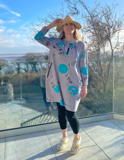 grey cotton stretch jersey tunic with turquoise fish print and half zip, two pockets with zip closure