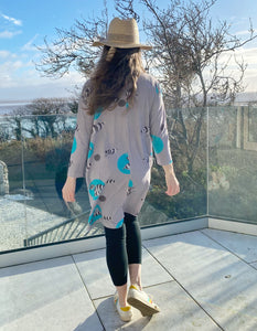 grey cotton stretch jersey tunic with turquoise fish print and half zip, two pockets with zip closure