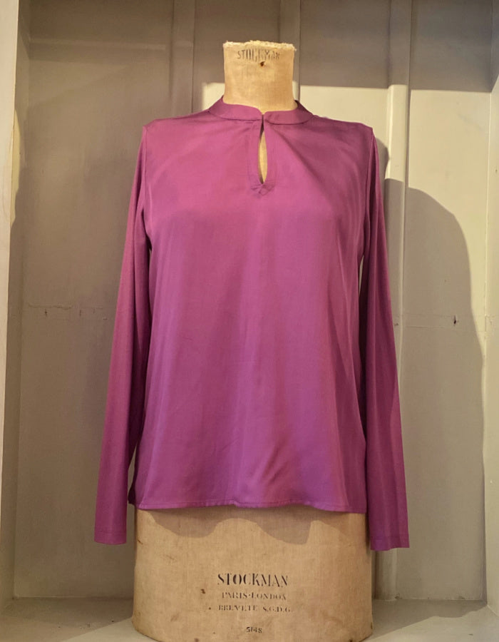 silky blouse with keyhole closure at the collar and full length sleeves in foxglove purple