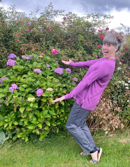 silky blouse with keyhole closure at the collar and full length sleeves in foxglove purple