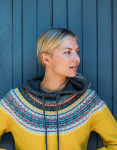 eribe alpine hooded sweater in piccalilli features sunny yellow in the main body with colourful fair Isle design in the yoke and a grey hood with drawstring ties
