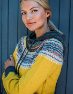 eribe alpine hooded sweater in piccalilli features sunny yellow in the main body with colourful fair Isle design in the yoke and a grey hood with drawstring ties